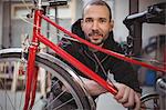 Portrait of smiling mechanic in workshop