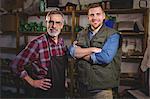 Portrait of cobbler men smiling in workshop