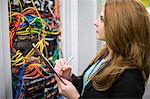 Technician preparing check list in in server room