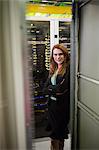 Portrait of technician with arms crossed in a server room