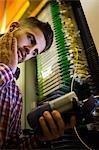 Technician using digital cable analyzer in server room