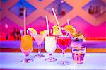 Cocktail glasses on counter at nightclub