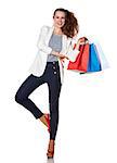Shopping. The French way. Full length portrait of smiling young woman with shopping bags on white background