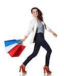 Shopping. The French way. Full length portrait of smiling young woman walking with French flag colours shopping bags on white background