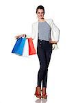 Shopping. The French way. Full length portrait of happy young woman with French flag colours shopping bags posing on white background