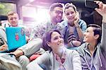 College students with laptop taking selfie with camera phone