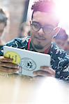 Young man using digital tablet at technology conference