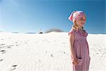 Girl standing on dune at White Sands National Monument, New Mexico, USA