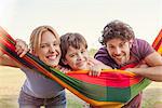 Family relaxing with hammock outdoors, portrait