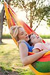 Mother and son napping together in hammock