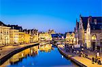 Belgium, Flanders, Ghent (Gent). Buildings along the Leie River and Graslei quay at dusk.