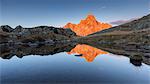 Europe, Italy, Trentino, Rolle pass. Cimon della Pala reflected in the lakes of Cavallazza at sunset, Dolomites