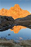 Europe, Italy, Trentino, Rolle pass. Cimon della Pala reflected in the lakes of Cavallazza at sunset, Dolomites