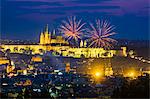Czech Republic, Prague, Vinohrady. Fireworks over Prague Castle, Prazsky Hrad, from Riegroy Sady park at dusk.