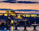 Czech Republic, Prague. Prague Castle, Pazsky Hrad, and the Vltava River at sunset from the Vysehrad.