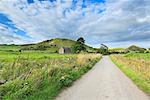 England, Staffordshire, Longnor. A country lane in the White Peak area of the Peak District near Longnor.