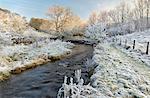 England, West Yorkshire, Calderdale. A stream flowing on a bitterly cold and frosty morning.