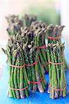 England, Norfolk, Burnham Market. Bunches of fresh locally grown asparagus on sale.