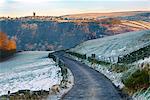 England, West Yorkshire, Hebden Bridge. A cobbled lane in the hills above Hebden Bridge looking across the valley to Heptonstall village.