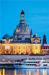 Germany, Saxony, Dresden, Altstadt (Old Town). Hochschule fur Bildende Kunste (Dresden Academy of Fine Arts) and the cupola of the Frauenkirche along the Elbe River at night.