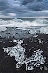 Iceland, Jokulsarlon. Icebergs on the black sand beach.