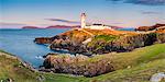 Fanad Head (Fánaid) lighthouse, County Donegal, Ulster region, Ireland, Europe. Panoramic view of the lighthouse and its cove at sunset.