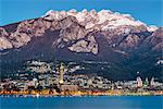 Lake Como, Lombardy, Italy. Lecco city at dusk with the Resegone mount in the background.