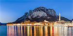 Lake Como, Lombardy, Italy. Lecco city at dusk with St Martin mount in the background.