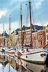 Boats and houses along Westerhaven canal, Groningen, Netherlands