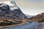 Scotland, Glencoe. Cars driving along the A82 in winter.