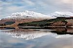 Scotland, Spean Bridge. Snow capped mountains reflected in the River Spean.