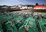 Scotland, Argyll and Bute, Isle of Jura. Lobster pots stacked on the jetty at Craighouse village.