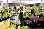 Portrait of female florist standing together in garden centre