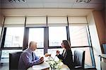 Businessman into discussion with colleague in office