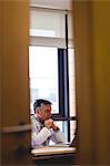 Doctor using laptop at his desk in the hospital