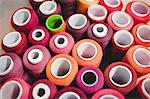 Colorful spools of thread in the box