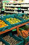 Variety of vegetables and fruits on shelf in supermarket