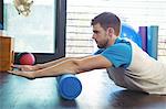 Man performing stretching exercise in the clinic