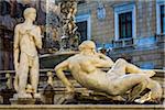Two male statues at the Pretoria Fountain in Piazza Pretoria (Pretoria Square) in the historic center of Palermo in Sicily, Italy