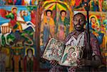 Priest showing an ancient religious book in an Orthodox Monastery, Tigray, Ethiopia