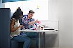 Young female and male college students planning with adhesive notes