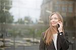 Businesswoman talking on smartphone, Freiburg, Germany