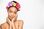 Portrait of woman wearing flower headband looking at camera