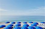 Rows of blue beach umbrellas, Nice, Cote d'azur, France