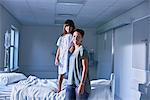 Portrait of girl patient and mother in hospital children's ward