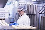 Woman working in food production factory