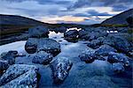 Calm water and boulders at Chasnayok river, Khibiny mountains, Kola Peninsula, Russia