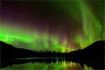 Green aurora borealis at Polygonal Lakes at night, Khibiny mountains, Kola Peninsula, Russia