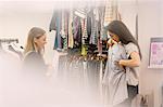 Fashion buyers examining clothing