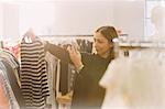 Fashion buyer photographing striped shirt